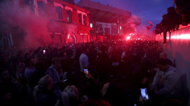 Liverpool fans gathered outside the stadium ahead of the lifting of the trophy