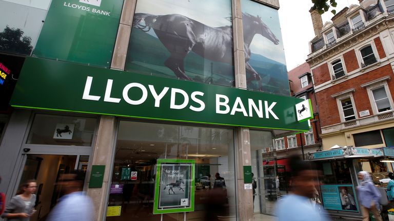 People walk past a branch of Lloyds Bank on Oxford Street in London, Britain July 28, 2016. REUTERS/Peter Nicholls/File Photo GLOBAL BUSINESS WEEK AHEAD PACKAGE - SEARCH &#39;BUSINESS WEEK AHEAD 24 OCT&#39; FOR ALL IMAGES