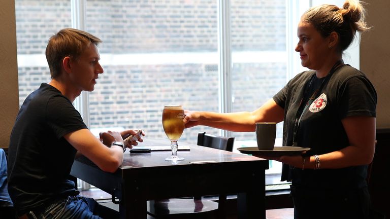 One of the first pints to be served inside a pub for more than three months