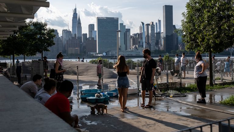 People try to maintain social distance at Gantry Plaza State Park in Long Island City, New York