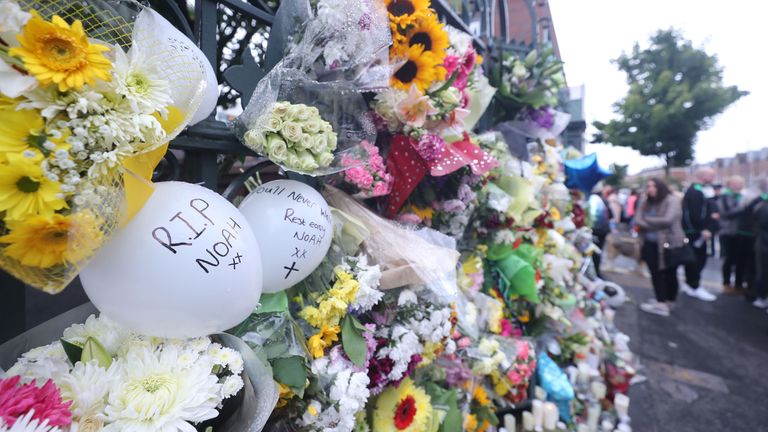 Flowers at St Malach's College where Noah went to school in Belfast