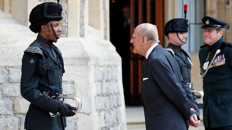 The Duke of Edinburgh speaks to a bugler at Windsor Castle