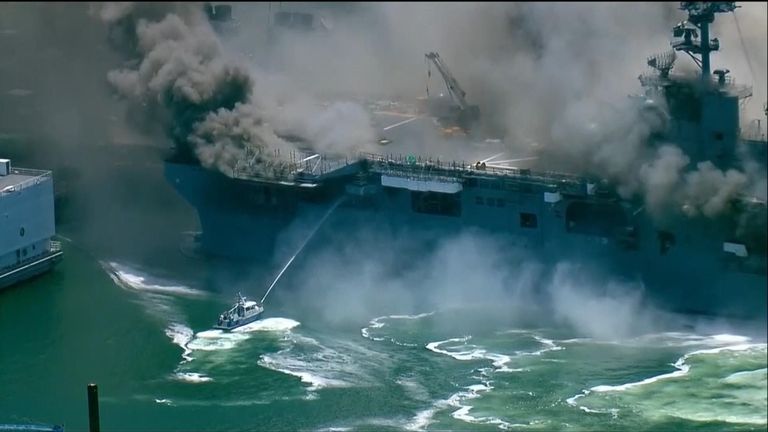 Smaller boats were trying to hose down the fire on the ship