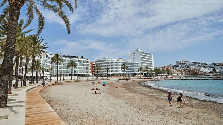 IBIZA, SPAIN - JULY 28: Tourists and locals sunbathe on Figueretas beach on July 28, 2020 in Ibiza, Spain. The United Kingdom, whose citizens comprise the largest share of foreign tourists in Spain, added Ibiza and other Spanish islands to its advice against non-essential travel to the country, citing a rise in coronavirus cases. The change follows the UK&#39;s decision to reimpose a 14-day isolation period for travelers returning from Spain. (Photo by Andres Iglesias/Getty Images)