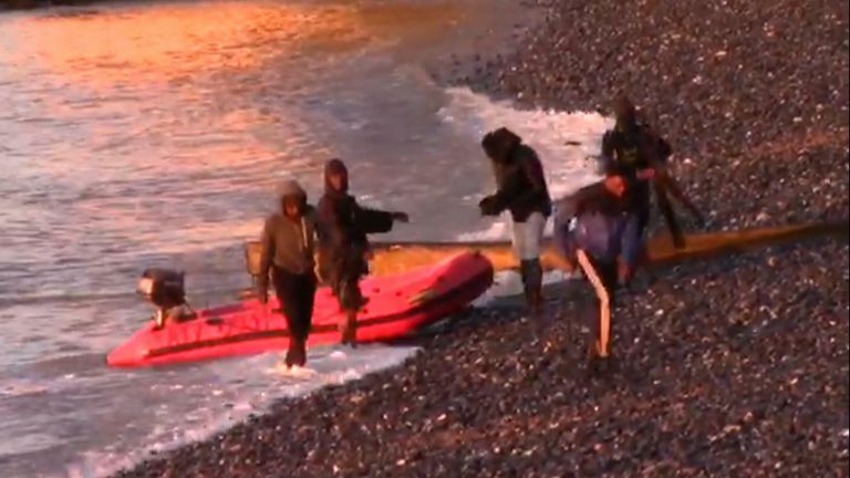 In the early hours of the morning migrants land their boat onto the pebbles of St Margaret&#39;s bay in Kent.