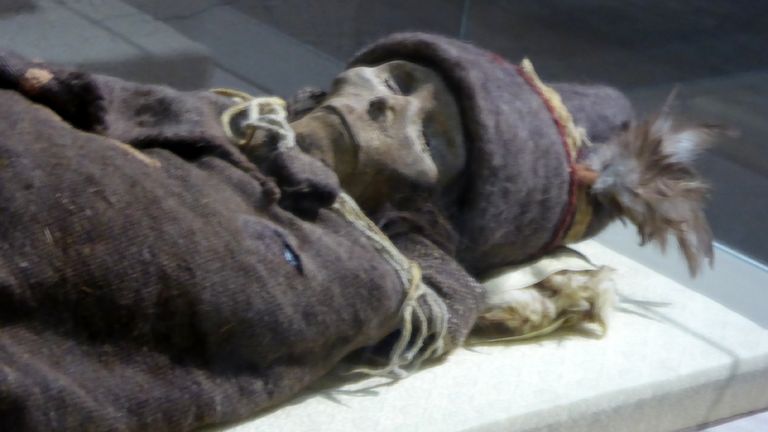 A 3,800-year-old mummified body found on the edge of the Tarim basin in Xinjiang, which is said to have European and other features