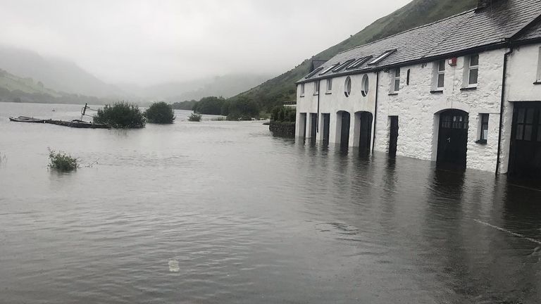 The road outside Ty'n y Cornel Hotel was under a foot of water. Pic: Ty'n y Cornel Hotel