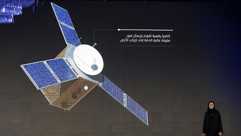 Sarah Amiri, deputy project manager of the United Arab Emirates (UAE) Mars Mission, stands on stage during a ceremony to unveil the mission on May 6, 2015 in Dubai. The UAE Mars Mission aims to provide a global picture of the Martian atmosphere through a probe named Al Amal to be launched in July 2020 to reach Mars in 2021, according to the engineers involved in the project. AFP PHOTO / KARIM SAHIB (Photo credit should read KARIM SAHIB/AFP via Getty Images)
