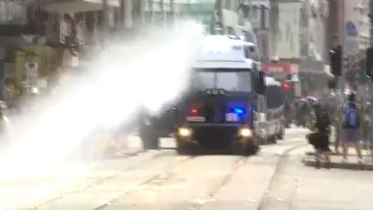 Water cannon being used on protesters in Hong Kong