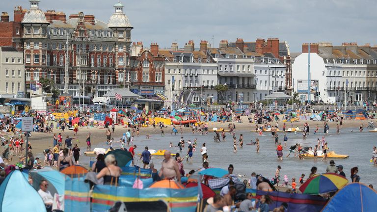 People playing in the sea on Weymouth beach in Dorset on Wednesday