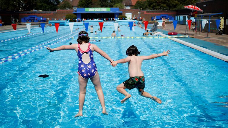 Not near a beach? Children jump into the pool at Charlton Lido in southeast London