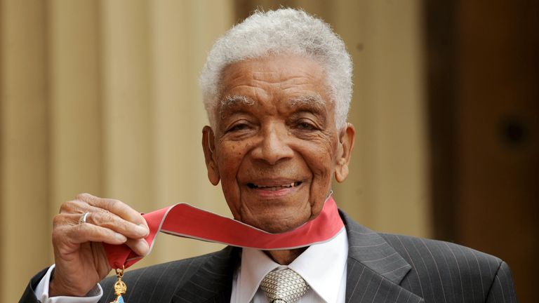 Earl Cameron outside Buckingham Palace with his CBE in 2009