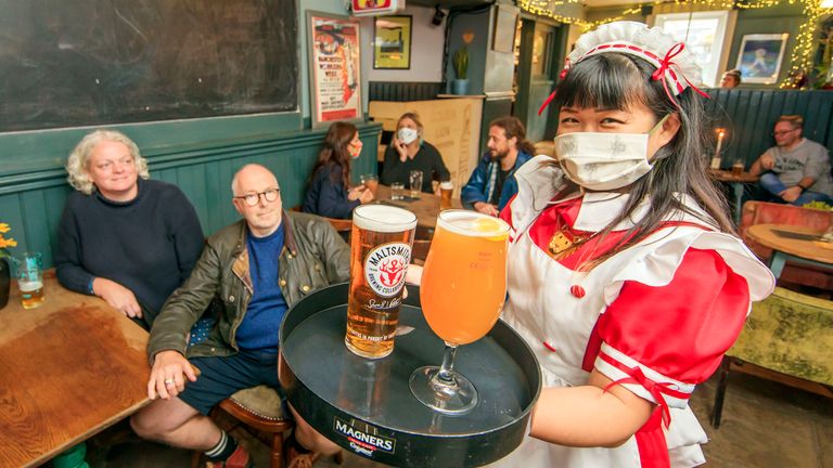 Drinks are served to customers at the Golden Lion pub in Todmorden, West Yorkshire