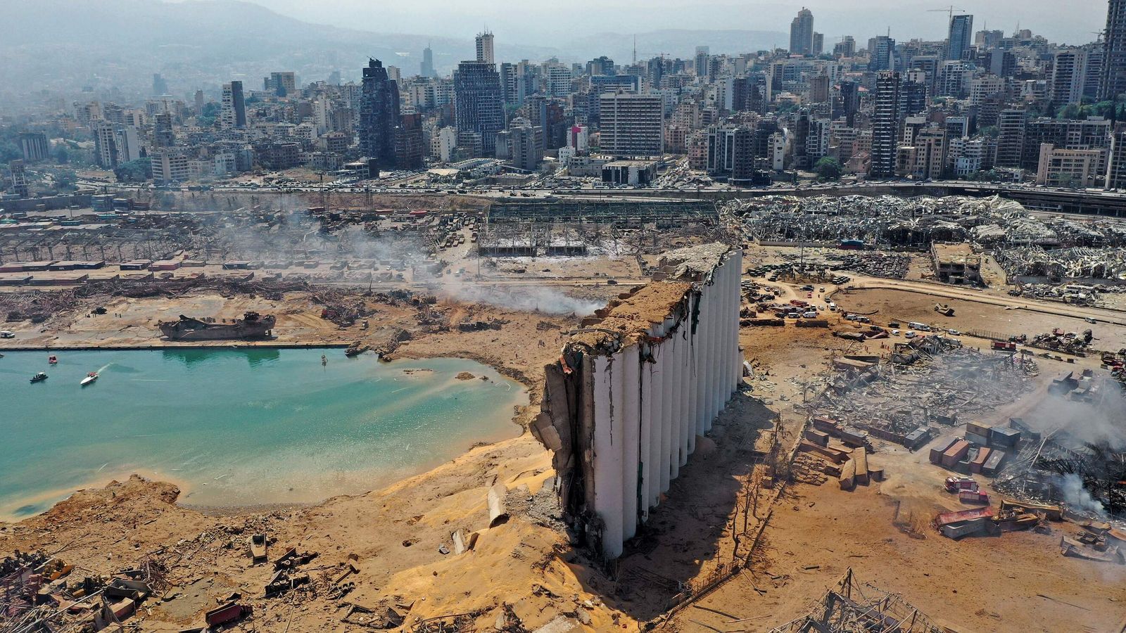 TOPSHOT - An aerial view shows the massive damage at Beirut port's grain silos and the area around it on August 5, 2020, one day after a massive explosion hit the heart of the Lebanese capital. - Rescuers searched for survivors in Beirut in the morning after a cataclysmic explosion at the port sowed devastation across entire neighbourhoods, killing more than 100 people, wounding thousands and plunging Lebanon deeper into crisis. (Photo by - / AFP) (Photo by -/AFP via Getty Images)