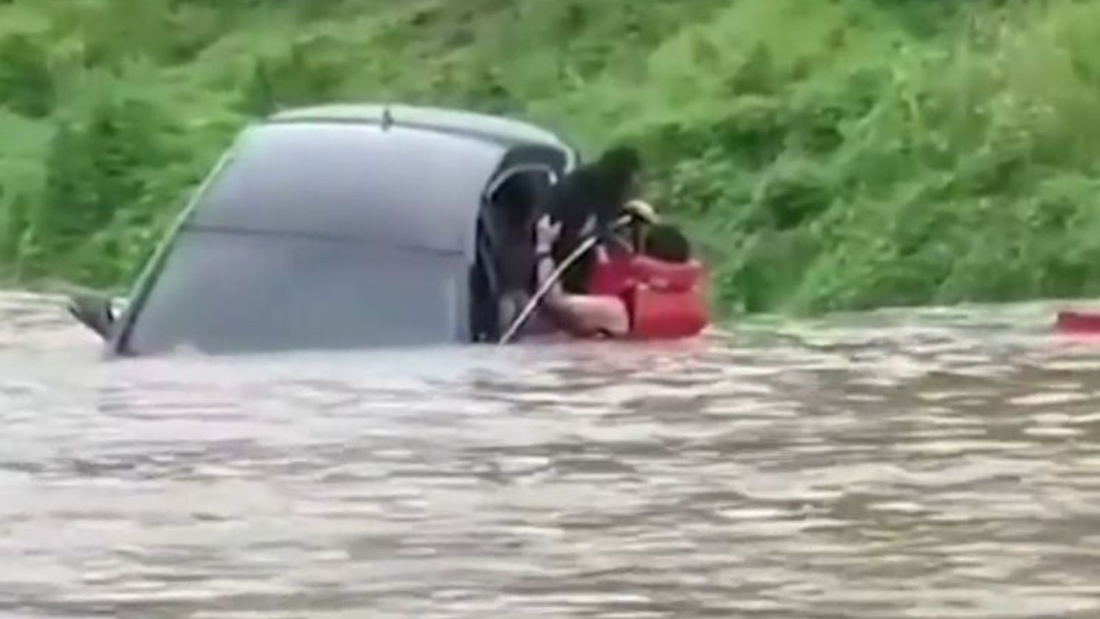 Woman rescued from flooded car in South Korea | World News | Sky News