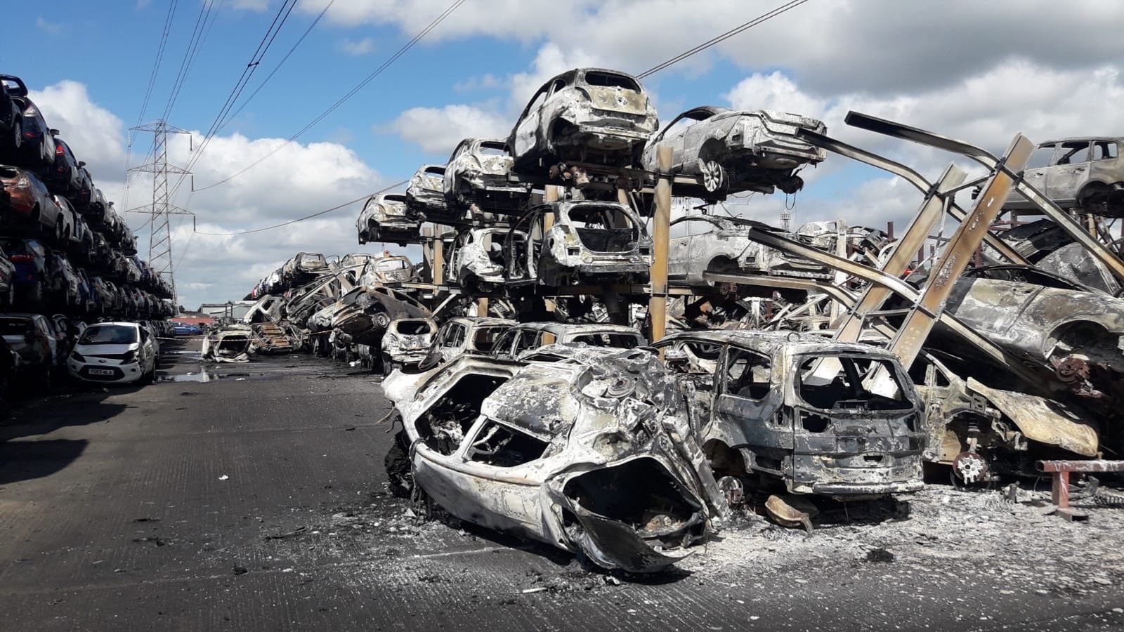 Hundreds of cars destroyed after fire breaks out at scrapyard UK News