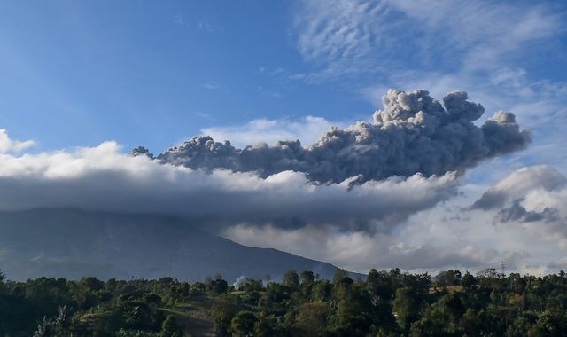 Mount Sinabung volcano erupts, sending column of ash 5,000m into the sky