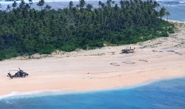 'SOS' message in sand saves three men stranded on deserted Pacific island