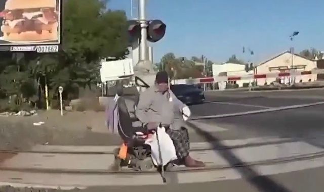 Policewoman saves man from oncoming train after his wheelchair got stuck on tracks