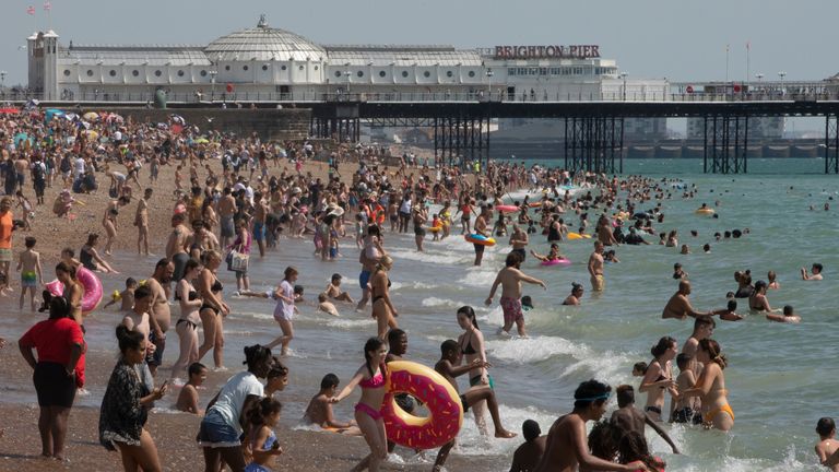 BRIGHTON, ENGLAND - JULY 31: Members of the public enjoy the sunshine on Brighton Beach on July 31, 2020 in Brighton, England. High temperatures are forecast across the UK today, with some areas in the south expected to reach 33-34C. (Photo by Dan Kitwood/Getty Images)