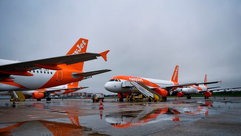 EasyJet lowcost airline aircrafts with their engines covered with plastic protection, remain on the tarmac of the Humberto Delgado airport in Lisbon on April 9, 2020. - Portuguese government decided to suspend all flights from April 9 to 13 to prevent the spread of the coronavirus COVID-19 outbreak. (Photo by PATRICIA DE MELO MOREIRA / AFP) (Photo by PATRICIA DE MELO MOREIRA/AFP via Getty Images)