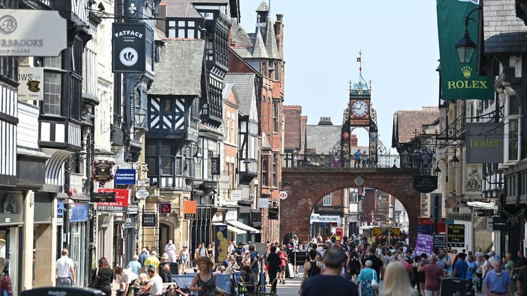 People walk through the centre of Chester, northwest England on August 12, 2020. - Britain's economy contracted by a record 20.4 percent in the second quarter with the country in lockdown over the novel coronavirus pandemic, official data showed Wednesday.  "It is clear that the UK is in the largest recession on record," the Office for National Statistics said. Britain officially entered recession in the second quarter after gross domestic product (GDP) contracted by 2.2 percent in the first three months of the year. (Photo by Paul ELLIS / AFP) (Photo by PAUL ELLIS/AFP via Getty Images)