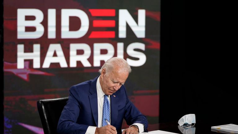 WILMINGTON, DE - AUGUST 14: Presumptive Democratic presidential nominee former Vice President Joe Biden signs required documents for receiving the Democratic nomination for President at the Hotel DuPont on August 14, 2020 in Wilmington, Delaware. Harris is the first Black woman and first person of Indian descent to be a presumptive nominee on a presidential ticket by a major party in U.S. history. (Photo by Drew Angerer/Getty Images)