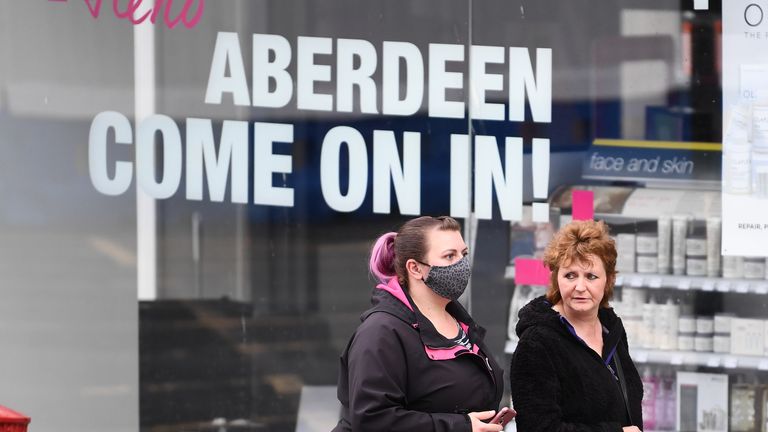 ABERDEEN, SCOTLAND - AUGUST 05: Two woman walk past closed shops on August 5, 2020 in Aberdeen, Scotland. Scotland's First Minister Nicola Sturgeon acted swiftly and put Aberdeen back into lockdown after cases of Coronavirus in the city doubled in a day to 54. She ordered all indoor and outdoor hospitality venues to close by 5pm. (Photo by Jeff J Mitchell/Getty Images)