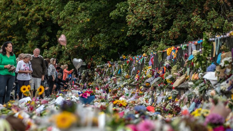 CHRISTCHURCH, NEW ZEALAND - MARCH 19: People view flowers and tributes by the botanical gardens on March 19, 2019 in Christchurch, New Zealand. 50 people were killed, and dozens are still injured in hospital after a gunman opened fire on two Christchurch mosques on Friday, 15 March.  The accused attacker, 28-year-old Australian, Brenton Tarrant, has been charged with murder and remanded in custody until April 5. The attack is the worst mass shooting in New Zealand's history. (Photo by Carl Court/Getty Images)