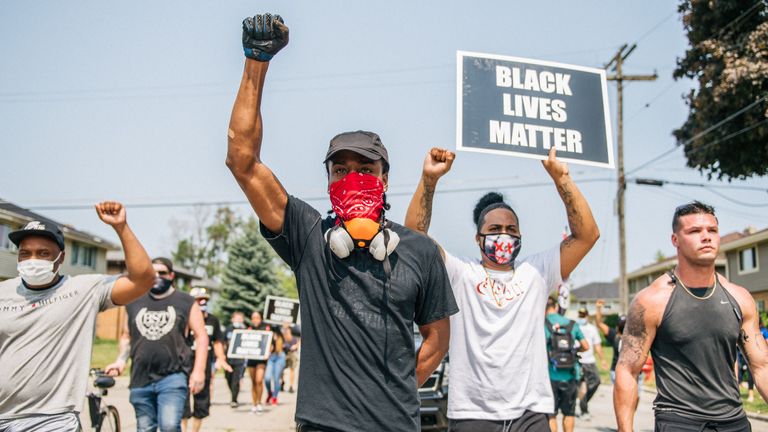 KENOSHA, WI - AUGUST 24: Demonstrators participate in a march on August 24, 2020 in Kenosha, Wisconsin. A night of civil unrest occurred after the shooting of Jacob Blake, 29, on August 23. Blake was shot multiple times in the back by Wisconsin police officers after attempting to enter into the drivers side of a vehicle.  (Photo by Brandon Bell/Getty Images)