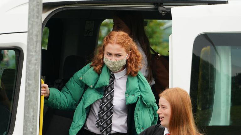 Pupils arrive by school bus at Kelso High School on the Scottish Borders as schools in Scotland start reopening on Tuesday amid concerns about the safety of returning to the classroom during the coronavirus pandemic.