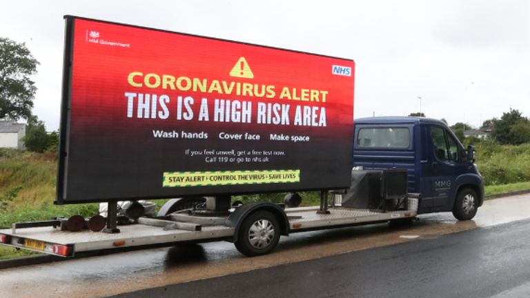 A mobile advertising vehicle displaying a coronavirus high risk area warning in Oldham, Greater Manchester, where residents have been told not to socialise with anyone outside their household and avoid using public transport unless it is essential. The localised measures have been introduced in Oldham, along with Blackburn and Pendle in Lancashire, following a rise in people testing positive for coronavirus.