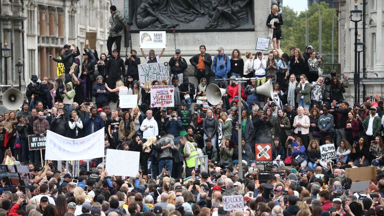 Anti-lockdown protesters, who believe that the coronavirus pandemic is a hoax, gather at the 'Unite For Freedom' rally in Trafalgar Square, London.