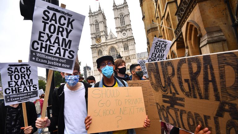 People take part in a protest in Westminster in London over the government&#39;s handling of A-level results