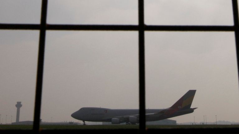 A passenger jet taxis along the runway at Stansted Airport in Essex