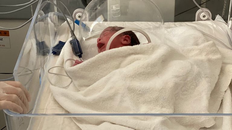 Seconds after the baby is born a swab is taken and her vital signs are recorded