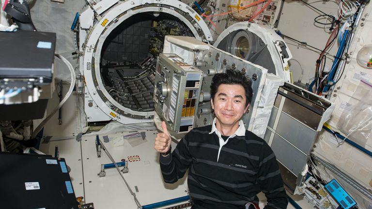 Japanese astronaut Mr. Yugi set up the exposure experiment module ExHAM on the International Space Station. Credit: JAXA/NASA