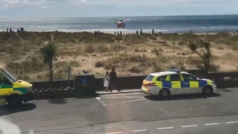 
Caption: Emergency services at Barmouth beach in Gwynedd, north Wales, on August 2, 2020