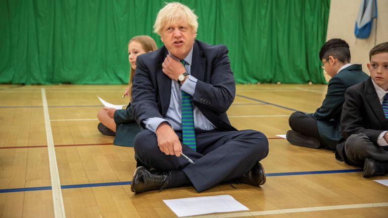 British Prime Minister Boris Johnson visits Castle Rock School while participating in an induction session to meet you on the student's first day back to school, in Coalville, Britain, on August 26, 2020. Jack Hill / Pool via REUTERS