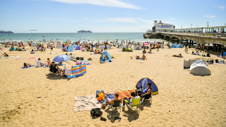 People flocked to a beach in Bournemouth on Saturday to enjoy the hot weather.