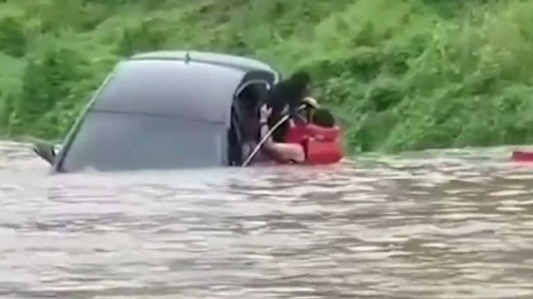 Woman is rescued from flooded car in South Korea