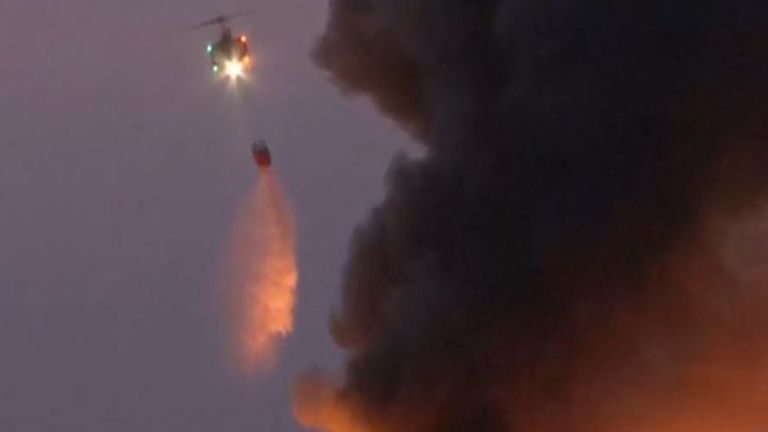 Chopper drops water on scene of Beirut explosion