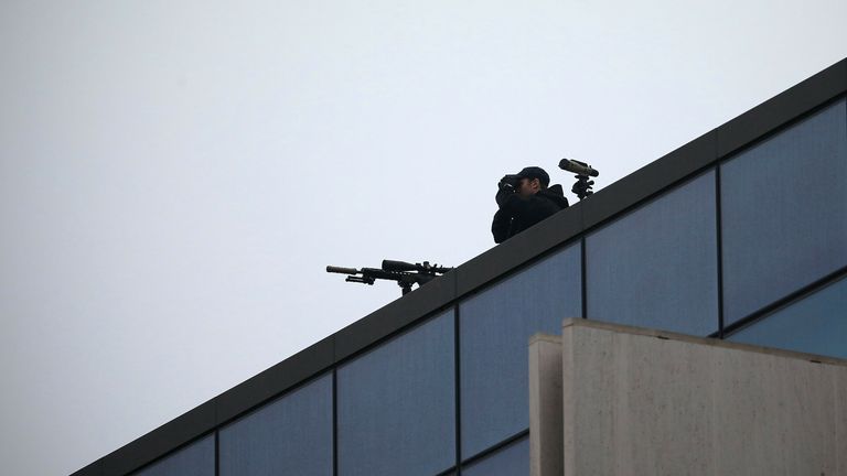 A police sniper monitors the surroundings from roof of the Christchurch High Court building ahead the first day of the four-day of the Australian white supremacist Brenton Tarrant&#39;s sentencing hearing in Christchurch