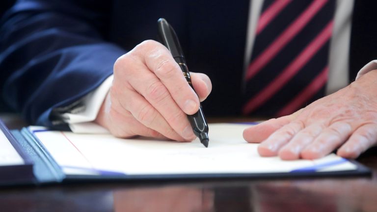 U.S. President Trump signs the Paycheck Protection Program and Health Care Enhancement Act response to the coronavirus disease outbreak at the White House in Washington