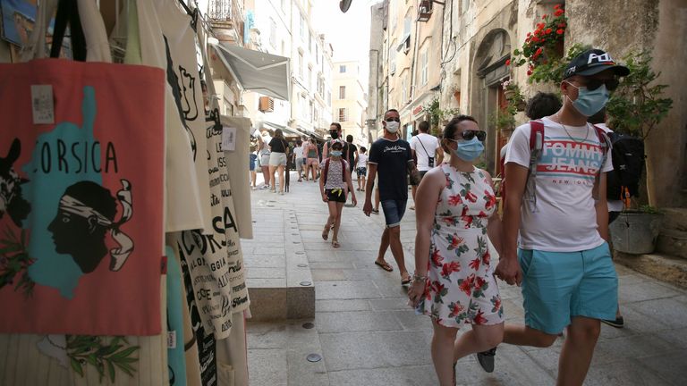 Tourists wear masks in the streets of Bonifacio, Corsica