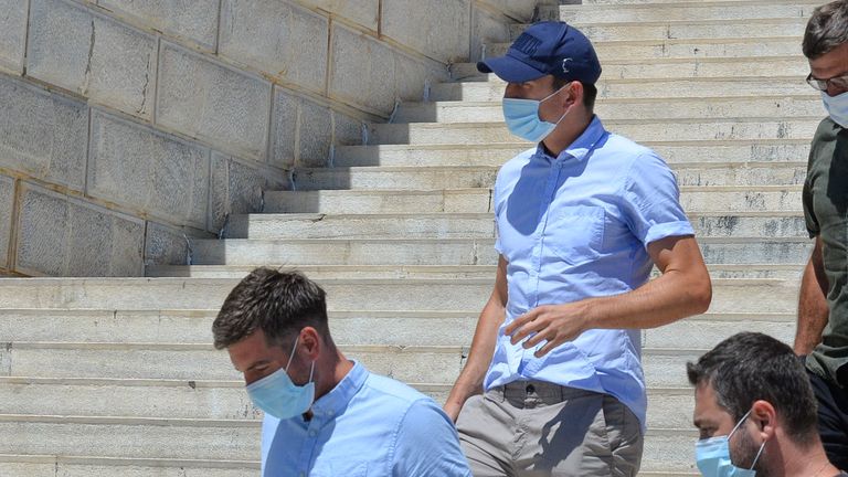 Manchester United captain Harry Maguire leaves a court building on the island of Syros, Greece