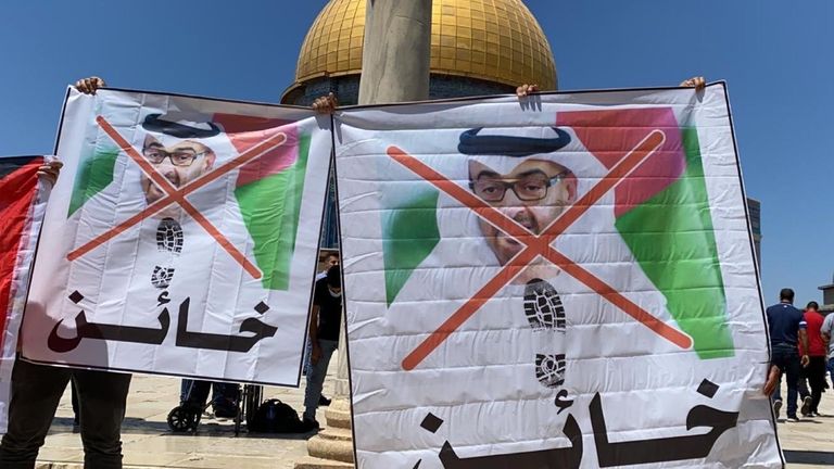 Palestinians in Jerusalem burning the UAE flag 