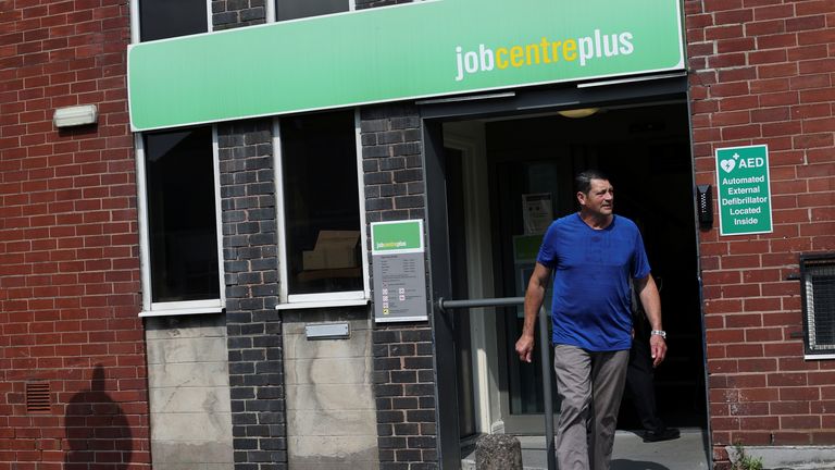 A man walks out of a Job Centre Plus office amid the coronavirus disease (COVID-19) outbreak, in Newcastle-under-Lyme
