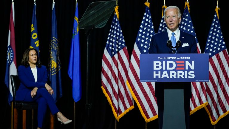 Joe Biden praised Ms Harris as a &#39;tough&#39; women as he spoke first