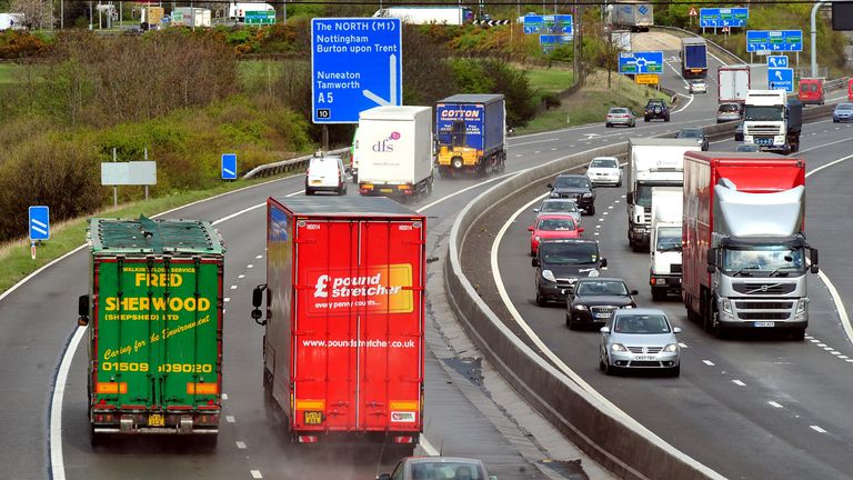 General view of HGV lorries on the M42 motorway.